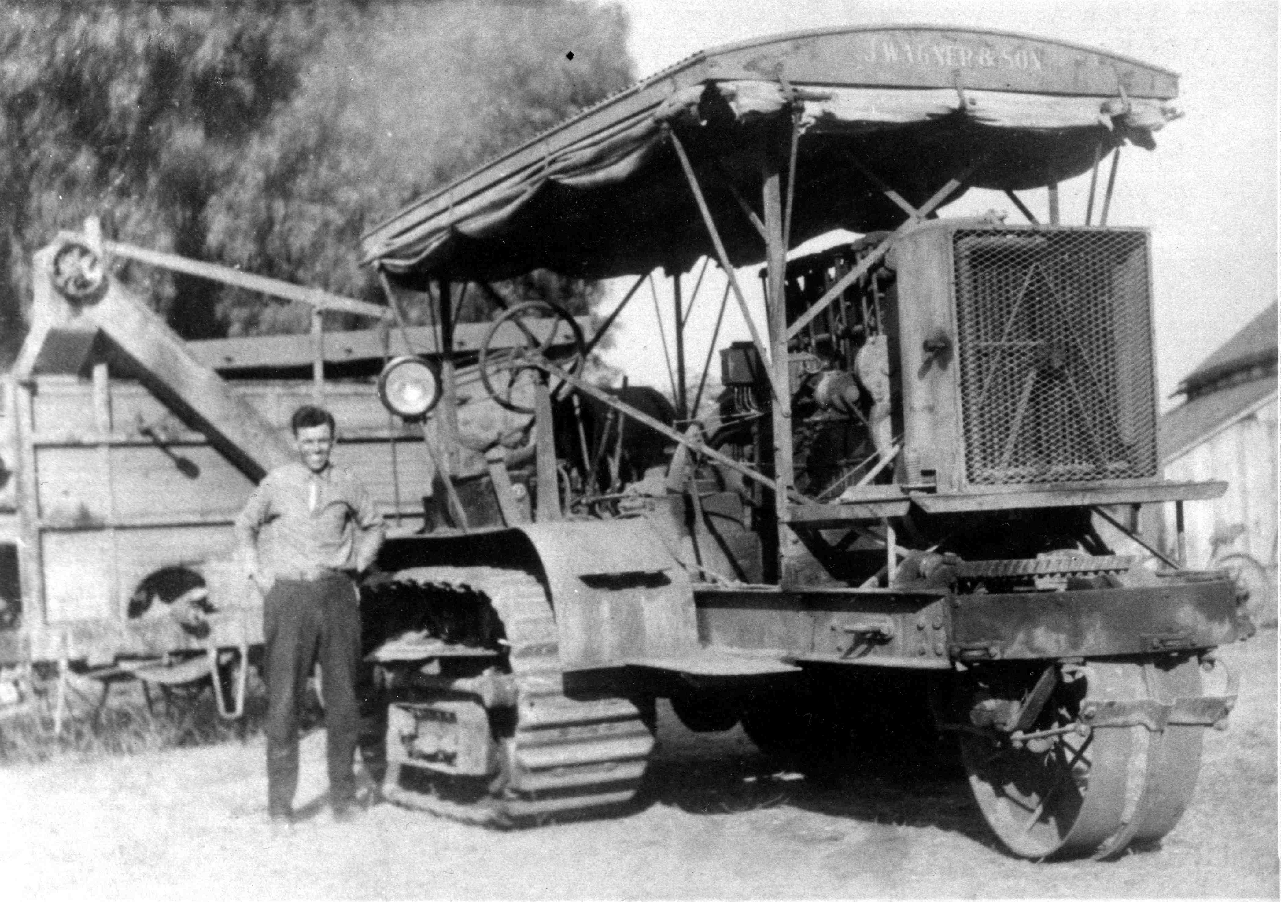 Otto Wagner and his new tractor.  Note, this was one of the first tractors used in Los Angeles County.